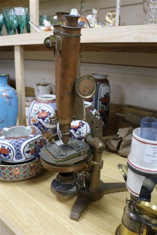 A Smith & Beck brass microscope, a bulls-eye condenser oil lamp, and a R & J Beck microscope microscope length 39cm